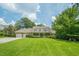 Well maintained home with lush green lawn and mature trees at 2814 Tanner Lake Nw Trl, Marietta, GA 30064