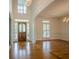Inviting foyer featuring hardwood floors, a soaring ceiling, and a beautiful stained wood front door at 2814 Tanner Lake Nw Trl, Marietta, GA 30064