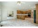 Open-concept kitchen with a peninsula counter, wood cabinets and modern appliances at 2814 Tanner Lake Nw Trl, Marietta, GA 30064