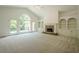 Spacious living room with high ceilings, fireplace, and access to an outdoor balcony at 2814 Tanner Lake Nw Trl, Marietta, GA 30064