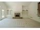 Bright living room featuring a stone fireplace and built-in shelving at 2814 Tanner Lake Nw Trl, Marietta, GA 30064