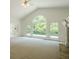 Living room boasting lots of sunlight, a fireplace, and doors to an outdoor balcony at 2814 Tanner Lake Nw Trl, Marietta, GA 30064