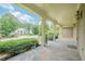 Covered porch featuring stone flooring and views of the surrounding landscape at 2814 Tanner Lake Nw Trl, Marietta, GA 30064