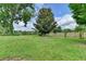 The expansive backyard is surrounded by a wooden fence and mature trees, perfect for privacy and outdoor enjoyment at 3573 Plantation Pl, Loganville, GA 30052