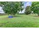 Spacious backyard with mature trees offers ample room for outdoor activities and recreation at 3573 Plantation Pl, Loganville, GA 30052