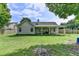 The well-maintained backyard offers lots of room to enjoy along with a covered patio area at 3573 Plantation Pl, Loganville, GA 30052