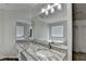 Bathroom with granite counters, vanity, and a large soaking tub at 3573 Plantation Pl, Loganville, GA 30052