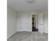 Bedroom showcases neutral walls, new carpeting, and two white doors at 3573 Plantation Pl, Loganville, GA 30052