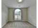 Bedroom features large arched window with blinds and neutral carpeting at 3573 Plantation Pl, Loganville, GA 30052