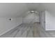 Bonus room features neutral walls, carpeting, and a staircase railing at 3573 Plantation Pl, Loganville, GA 30052