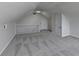 Bonus room features neutral walls, carpeting, and a staircase railing at 3573 Plantation Pl, Loganville, GA 30052