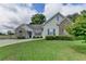 Charming home featuring stone accents, a well-maintained lawn, and a traditional architectural style at 3573 Plantation Pl, Loganville, GA 30052