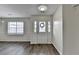 Bright foyer features new flooring, a decorative light fixture, and a front door with sidelights at 3573 Plantation Pl, Loganville, GA 30052