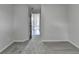 Hallway view shows hardwood flooring, neutral walls, and white trim at 3573 Plantation Pl, Loganville, GA 30052