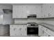 Stylish kitchen equipped with granite countertops, stainless steel appliances, and ample storage at 3573 Plantation Pl, Loganville, GA 30052