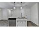 Kitchen island with granite countertop offers extra prep space, storage, and a stainless steel dishwasher at 3573 Plantation Pl, Loganville, GA 30052