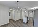 Updated kitchen with granite counters, white cabinets, and new flooring at 3573 Plantation Pl, Loganville, GA 30052
