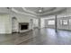 Inviting living room with a stone fireplace, built-in shelves, and view of the front entry at 3573 Plantation Pl, Loganville, GA 30052