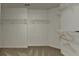 Walk-in closet featuring ample shelving and carpeted flooring at 3573 Plantation Pl, Loganville, GA 30052