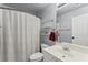 Well-lit bathroom featuring a shower, a toilet, a vanity with a sink, and neutral color at 7090 River Island Cir, Buford, GA 30518