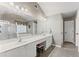 Bright bathroom with dual sinks, a large mirror, and tile flooring at 7090 River Island Cir, Buford, GA 30518