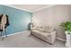 Serene bedroom featuring soft colors, a comfortable sofa, and bright natural light at 7090 River Island Cir, Buford, GA 30518