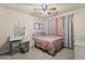Comfortable bedroom with carpeted floor and large window at 7090 River Island Cir, Buford, GA 30518