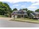 Lovely two-story home with a two-car garage and manicured landscaping at 7090 River Island Cir, Buford, GA 30518