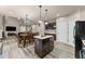 Open floor plan featuring fireplace, two-story ceilings and an open eat-in kitchen at 7090 River Island Cir, Buford, GA 30518