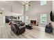 Spacious living room featuring fireplace, two-story ceilings and open floor plan at 7090 River Island Cir, Buford, GA 30518