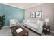 Bright living room with comfortable seating and decorative art at 7090 River Island Cir, Buford, GA 30518