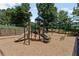 Fun playground area with slides, swings, and a picnic table, ideal for Gathering enjoyment at 7090 River Island Cir, Buford, GA 30518