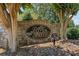 Stone monument sign reading 'River Falls' surrounded by trees and greenery at 7090 River Island Cir, Buford, GA 30518