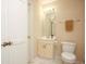 Simple bathroom features a vanity, mirror, and neutral finishes at 177 Rustin Dr, Dallas, GA 30157