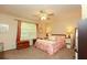 Comfortable bedroom with neutral tones, a ceiling fan, and a window for natural light at 177 Rustin Dr, Dallas, GA 30157
