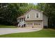 Charming two-story home featuring an attached two-car garage and a well maintained yard surrounded by trees at 177 Rustin Dr, Dallas, GA 30157