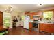 Well-lit kitchen featuring stainless steel appliances, wood cabinets and an adjacent dining area at 177 Rustin Dr, Dallas, GA 30157