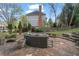 Backyard patio area with a lounge area and steps leading to the yard at 295 Sagamore Nw Cv, Sugar Hill, GA 30518