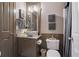 Elegant bathroom featuring a vessel sink, decorative wall art, and neutral tones at 295 Sagamore Nw Cv, Sugar Hill, GA 30518