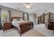 Comfortable carpeted bedroom with bedside tables and natural lighting at 295 Sagamore Nw Cv, Sugar Hill, GA 30518