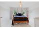 Simply decorated bedroom with carpet floors and natural light at 295 Sagamore Nw Cv, Sugar Hill, GA 30518