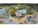 Overhead shot displaying tennis courts, a pool area, and clubhouse amenities in a community setting at 295 Sagamore Nw Cv, Sugar Hill, GA 30518