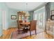 Cozy dining room with hardwood floors and plenty of natural light at 295 Sagamore Nw Cv, Sugar Hill, GA 30518