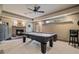 This game room features a pool table and stone fireplace at 295 Sagamore Nw Cv, Sugar Hill, GA 30518