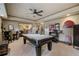 This game room offers a stylish pool table, bar and entertainment area at 295 Sagamore Nw Cv, Sugar Hill, GA 30518