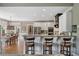 Bright kitchen with barstool seating and an open layout to the dining area at 295 Sagamore Nw Cv, Sugar Hill, GA 30518