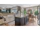 Elegant kitchen with hardwood floors and seamless flow into the dining area at 295 Sagamore Nw Cv, Sugar Hill, GA 30518