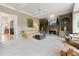 Inviting living room featuring built-in shelving, a cozy fireplace, and an open doorway at 295 Sagamore Nw Cv, Sugar Hill, GA 30518