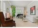 Elegant living room features neutral colors and natural light at 295 Sagamore Nw Cv, Sugar Hill, GA 30518