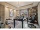 This office has a large picture window and modern chandelier at 295 Sagamore Nw Cv, Sugar Hill, GA 30518